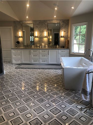 There is a bathtub in the middle of the bathroom.