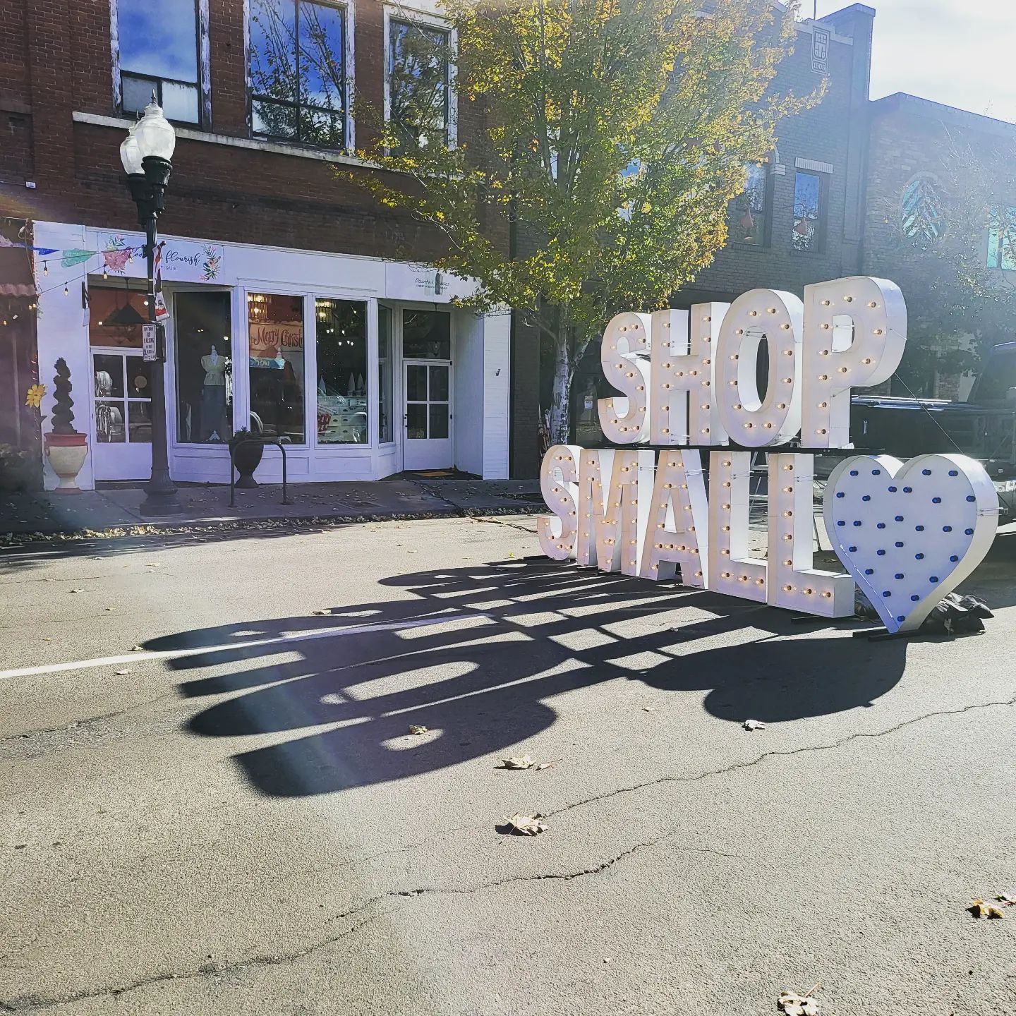 Shop Small marquee sign in Downtown Klamath Falls in front of local businesses Painted Pieces and Bloom & Flourish during the Small Business Saturday event.