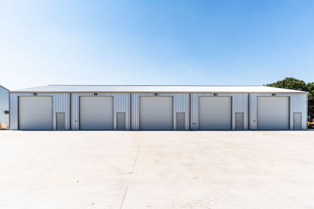 A large empty warehouse with a metal roof