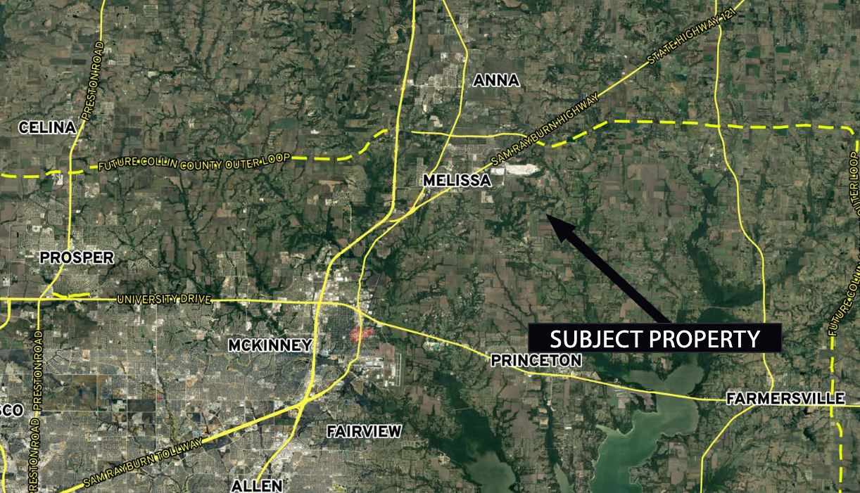 An aerial view of a city with a black arrow pointing to the subject property - BT Garages.