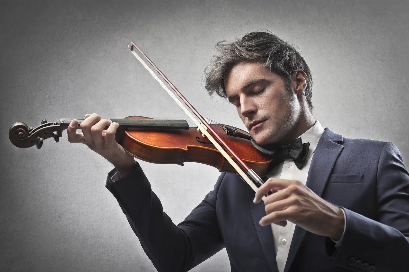 Hearing Aid — Man Playing A Violin in Sanford FL