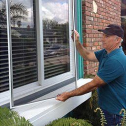 Man Installing New Window — Window Screens in Goleta, CA