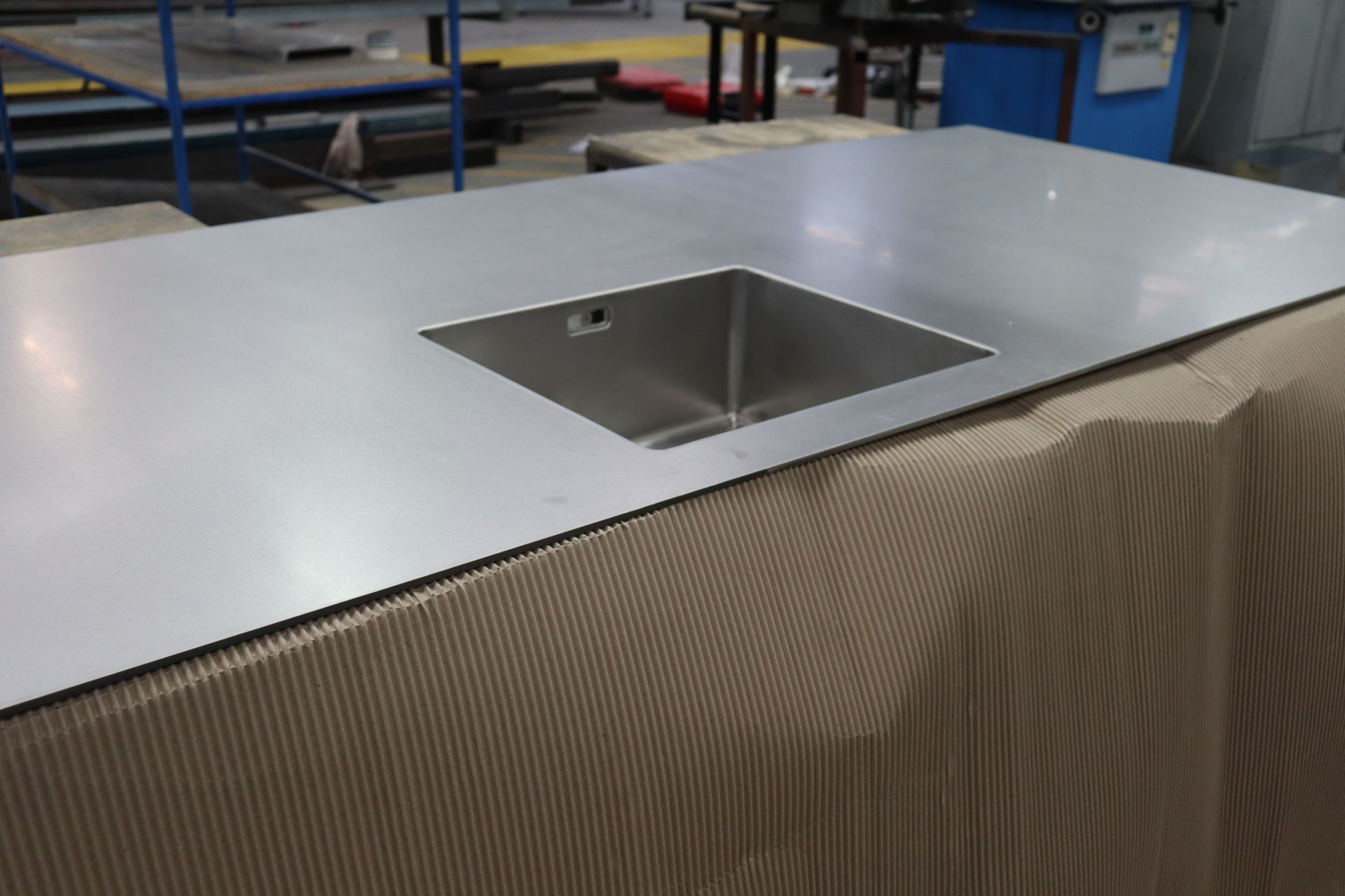 A person is holding a piece of metal in their hands.