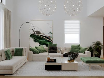 Spacious living room with light sofas, green pillows, abstract art, and modern lighting.