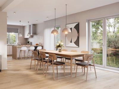 Bright dining room with wooden table, chairs, and kitchen in the background. Large windows provide natural light.