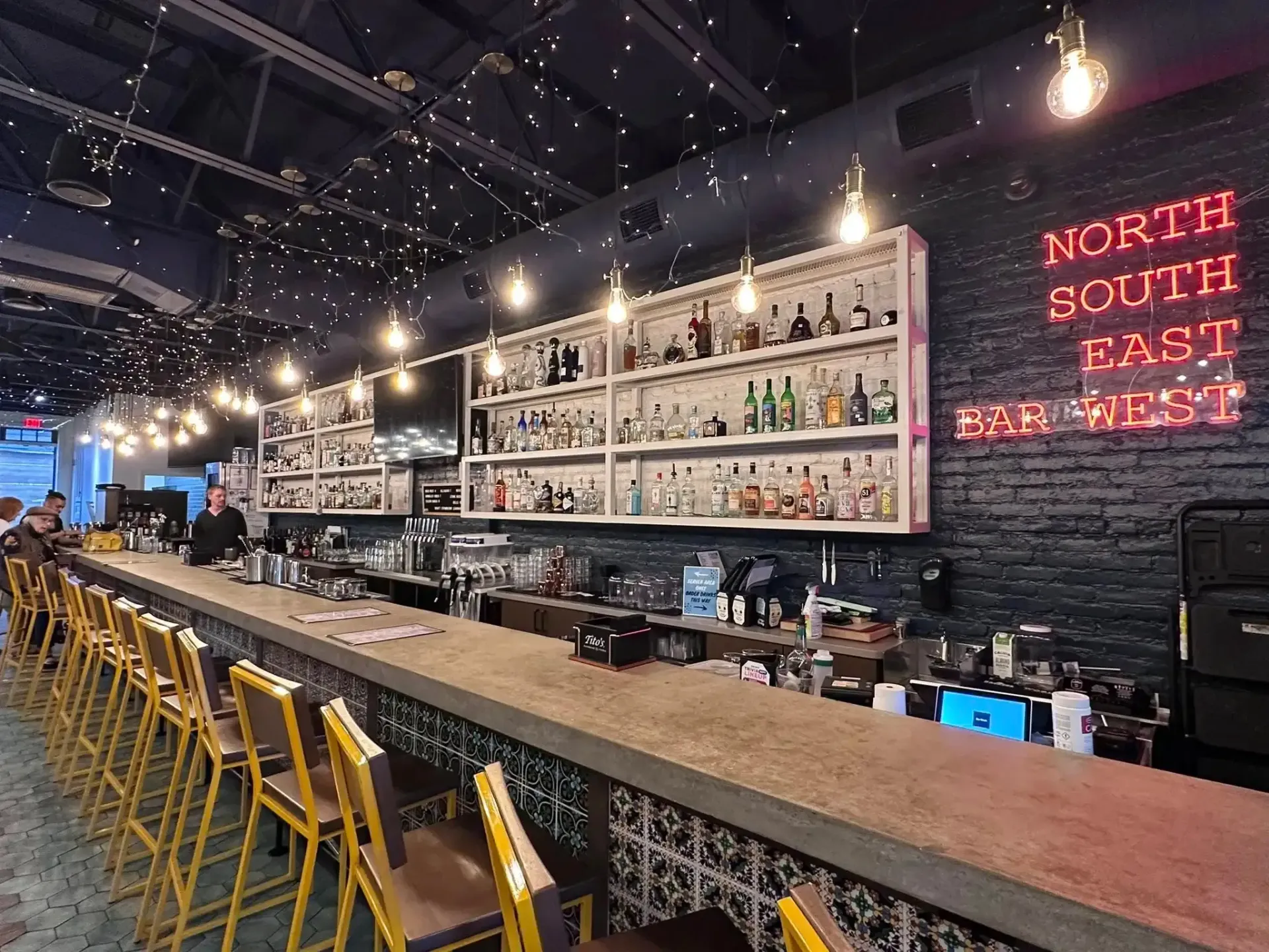 Bar with bottles, neon sign