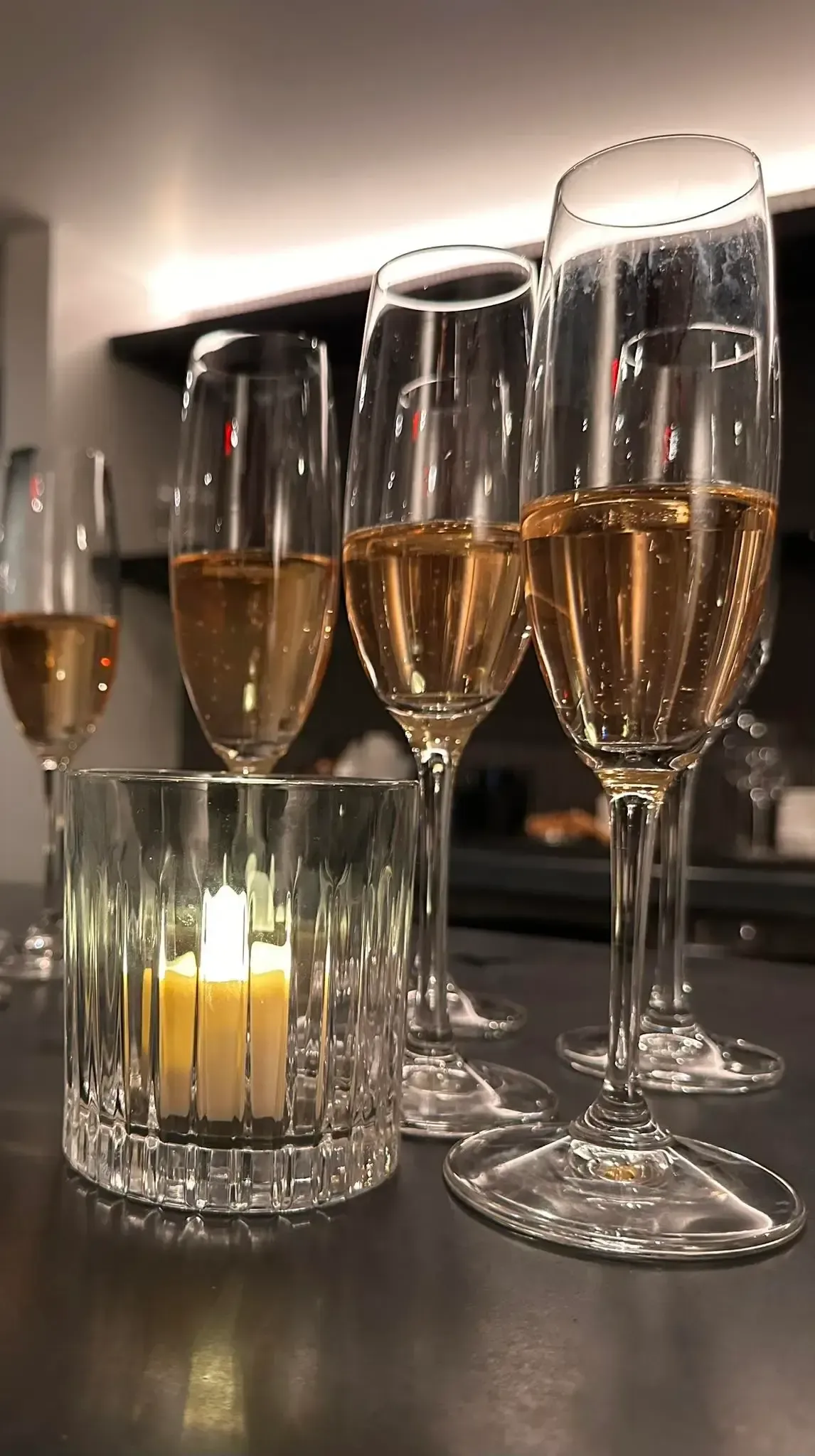 Red brick building with black awning, sign and menu; shop entrance visible on the right.