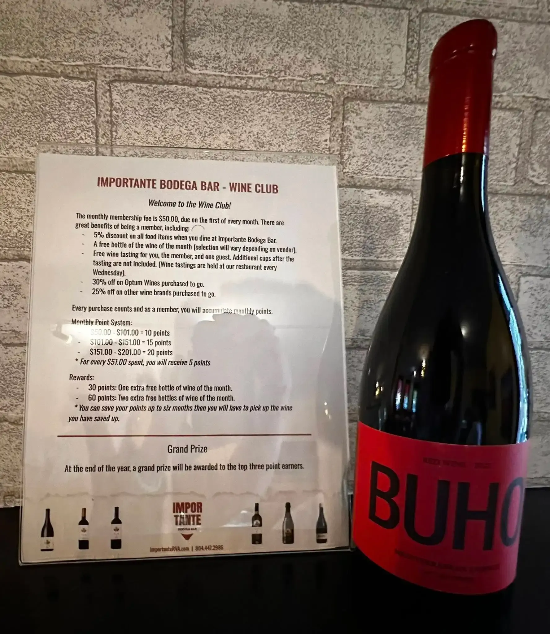 Wine bottle with red label reading