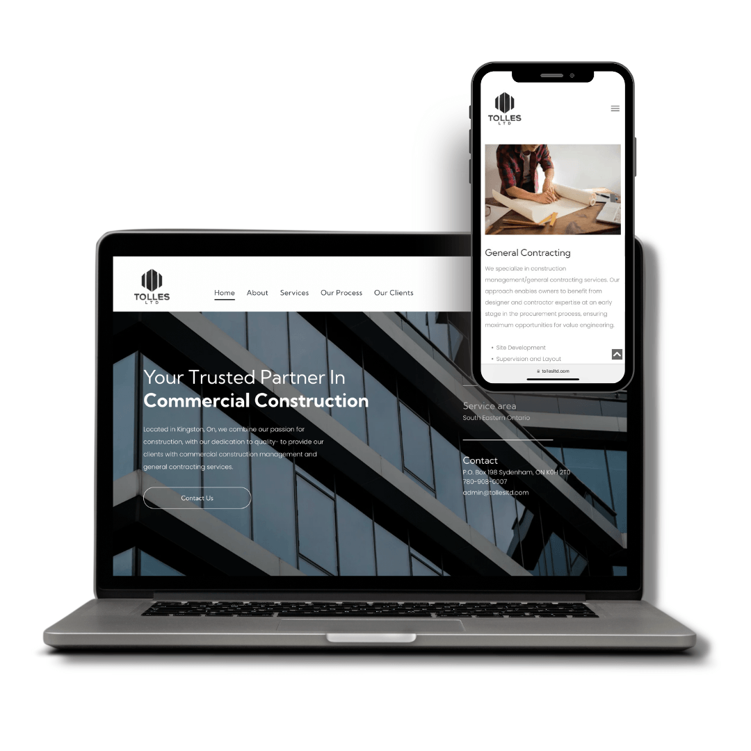 A laptop and a cell phone are displaying a website for commercial construction.