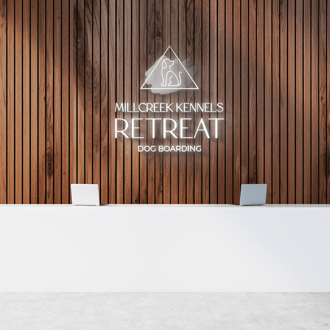Millcreek kennels retreat dog boarding sign on a wooden wall