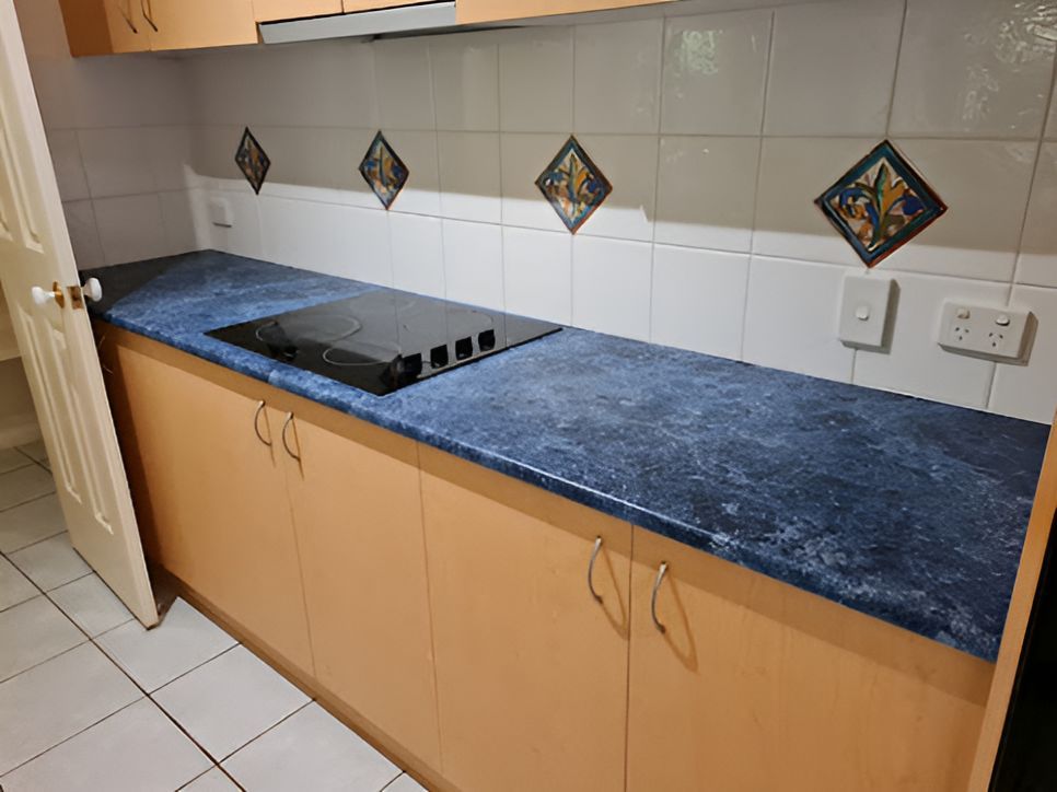 A Kitchen With Blue Counter Tops And A Stove Top Oven — A1 Cleaner Carpets N Homecare In Mareeba, QLD