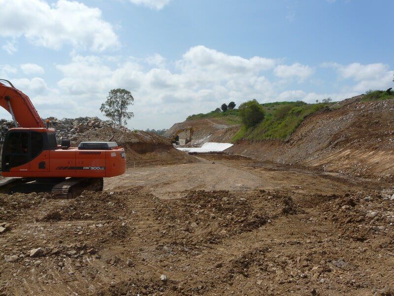 Excavator on a Construction Site — Earthmoving & Excavation Services in Rockhampton, QLD