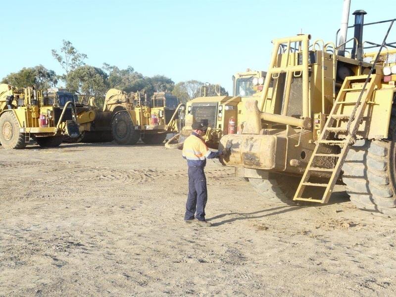 Checking The Machines — Earthmoving & Excavation Services in Rockhampton, QLD