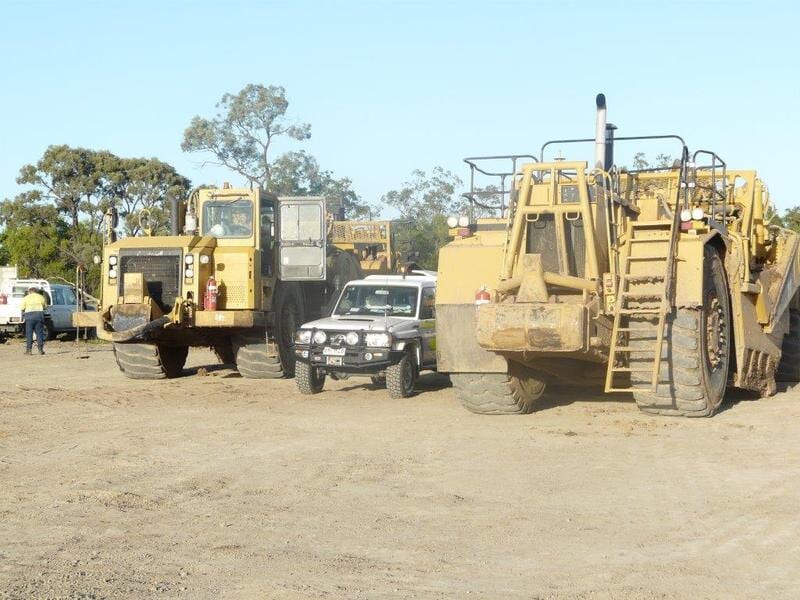 Tractors and a Car — Earthmoving & Excavation Services in Rockhampton, QLD