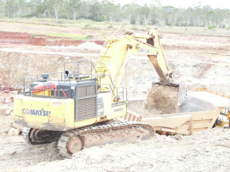 Loader Loading Rocks — Earthmoving & Excavation Services in Rockhampton, QLD