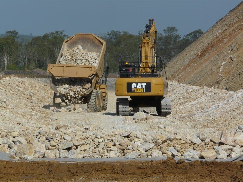 Truck and a Excavator — Earthmoving & Excavation Services in Rockhampton, QLD