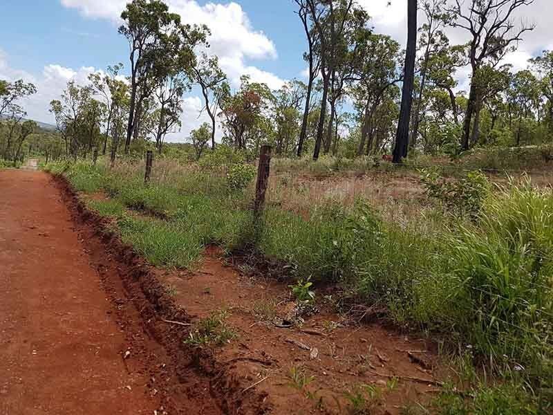 Rough Road with Fences at the Side — Earthmoving & Excavation Services in Rockhampton, QLD