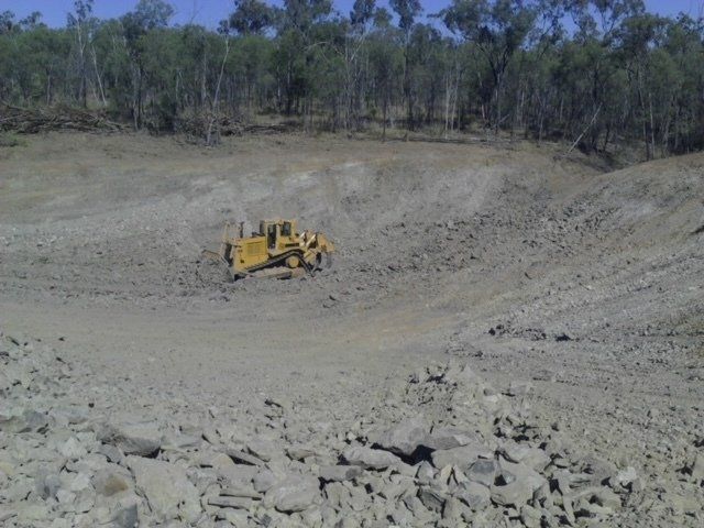 Bulldozer Performing Dredging Work — Earthmoving & Excavation Services in Rockhampton, QLD