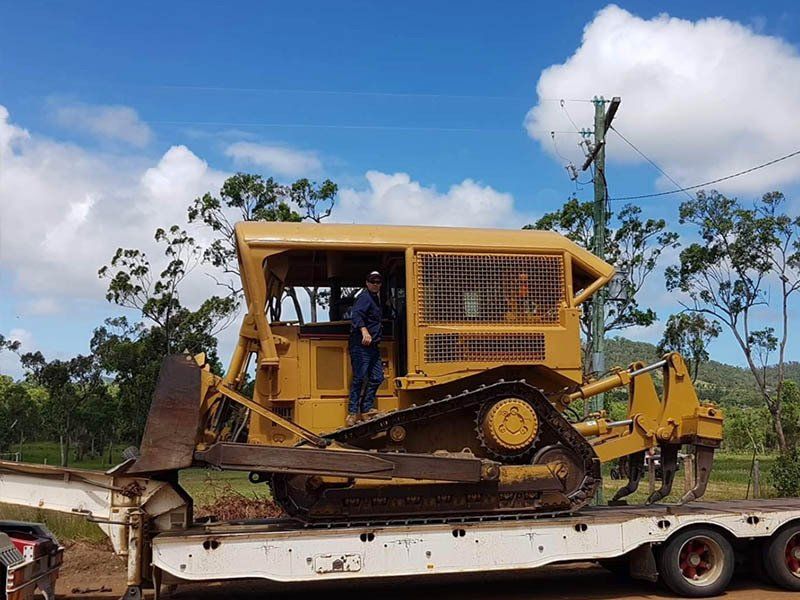 Man Standing in Excavator Machine — Earthmoving & Excavation Services in Rockhampton, QLD