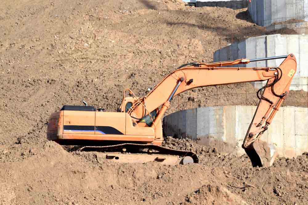 Excavator Performs Excavation In The Construction Of A Dam in Rockhampton
