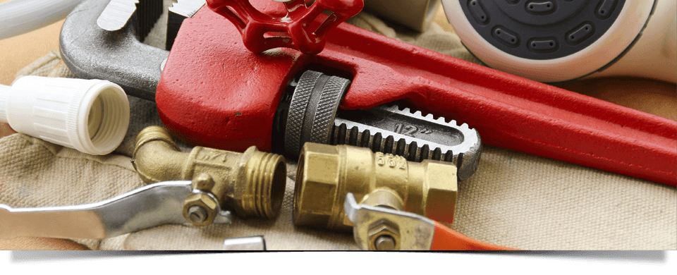 pipe wrench and disassembled pipes for plumbing