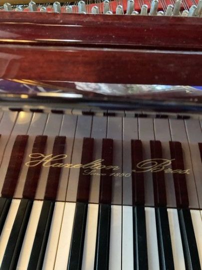 a piano with the word hamilton on the keys
