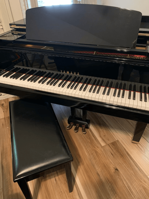 a piano with the word hamilton on the keys