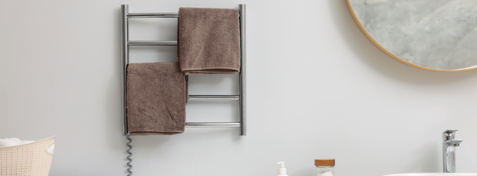 A bathroom with a towel rack and a sink.