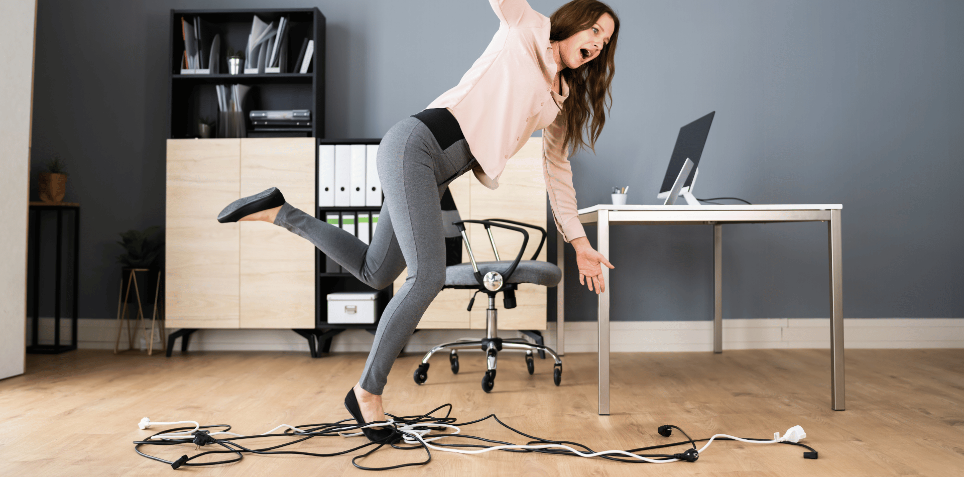 Woman tripping over power cords