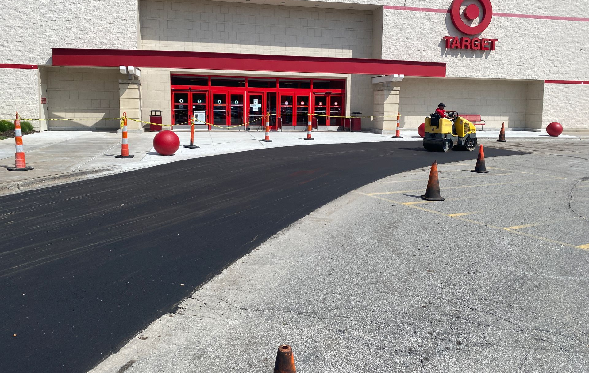 Blue IKEA store with a large, mostly empty parking lot under a clear blue sky. Blue IKEA store with a large, mostly empty parking lot under a clear blue sky.