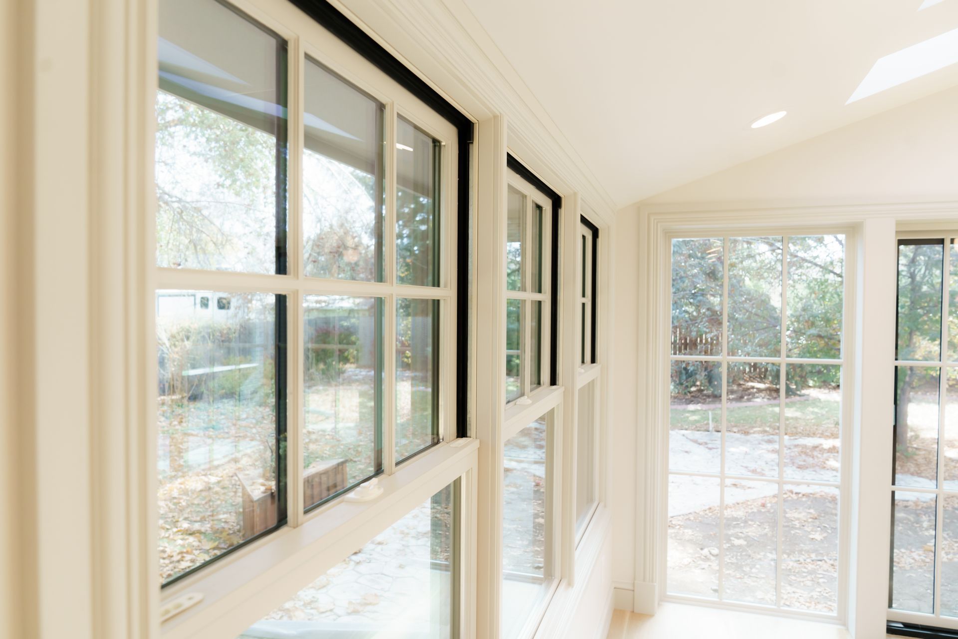 A room with a lot of windows and a skylight.