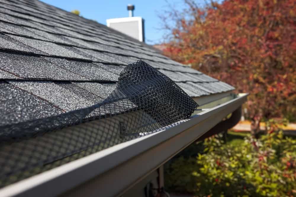 A Close Up Of A Gutter On A Roof With A Mesh On It — Ausmade Services Pty Ltd in Chapel Hill, QLD