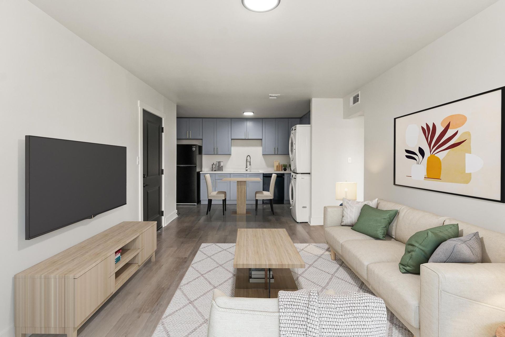 A living room with a couch and a flat screen tv