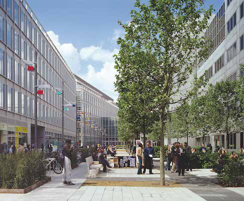 People gathering in a modern courtyard between glass office buildings and trees.