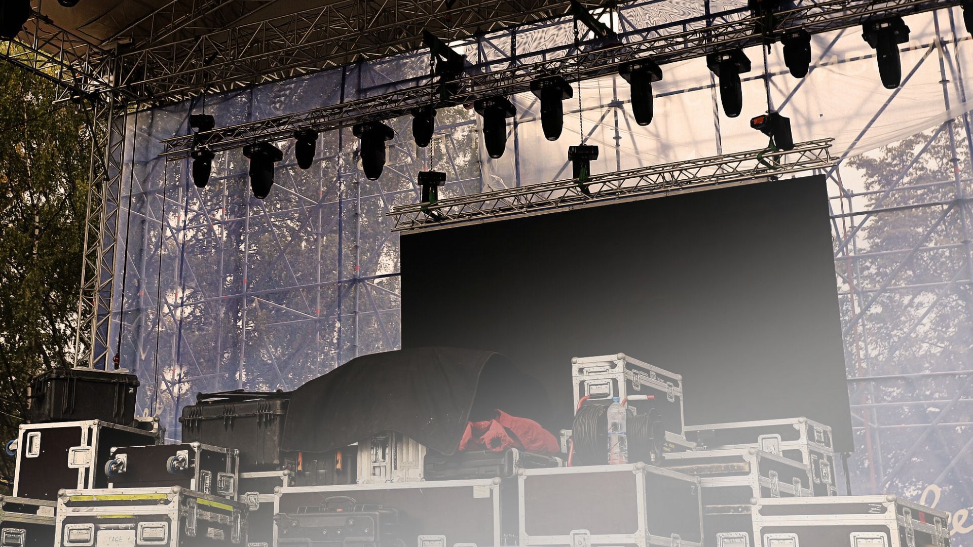 A stage with a lot of lights and boxes on it