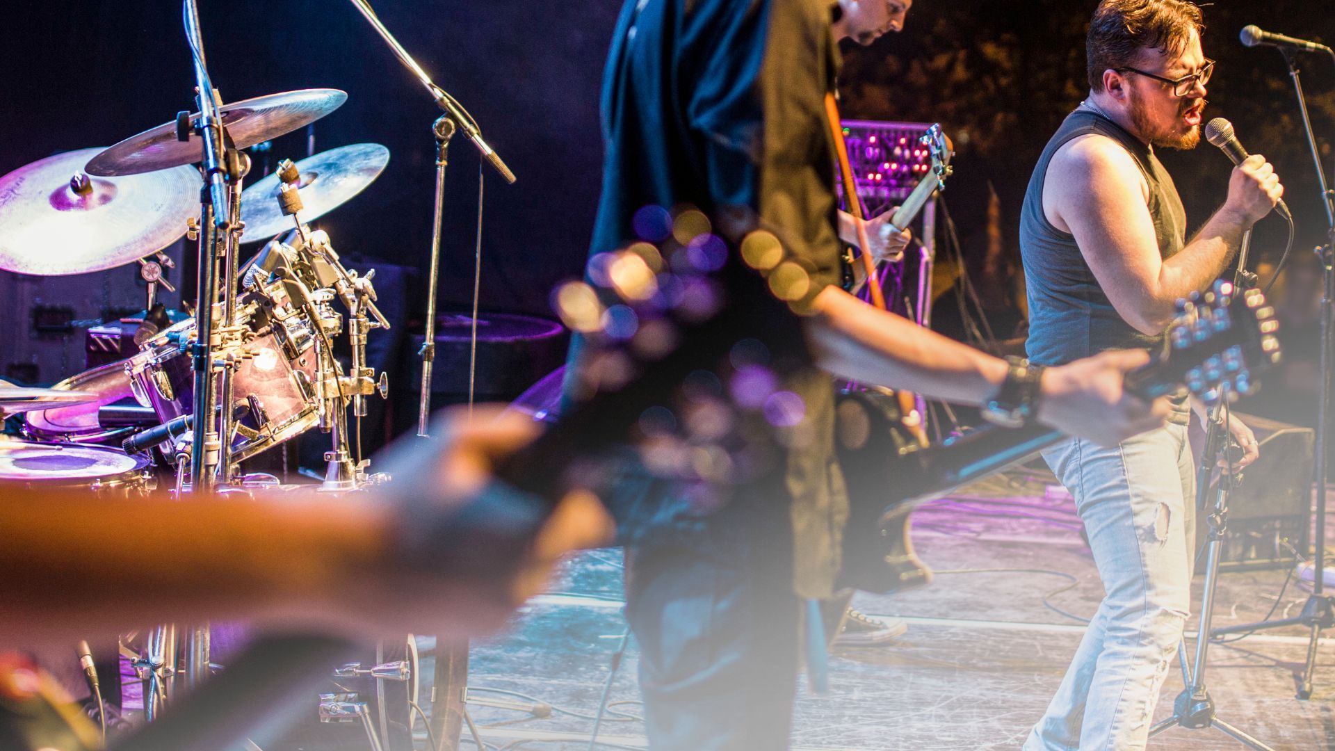 A group of people are playing instruments on a stage.