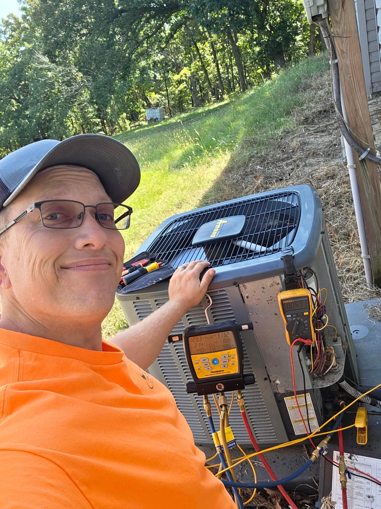 A wooden fence is sitting in the middle of a grassy field.