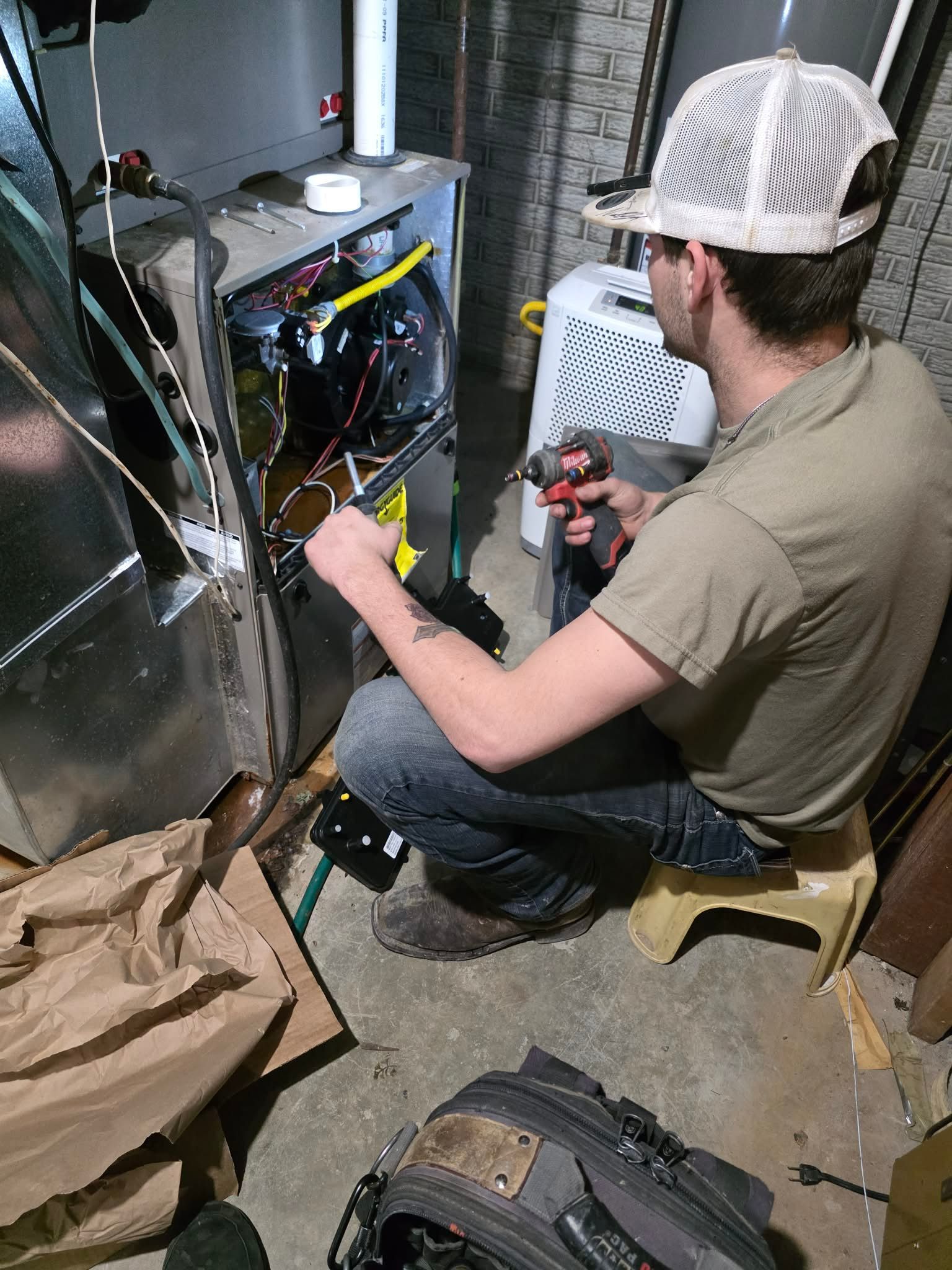 A wooden fence is sitting on top of a lush green field.