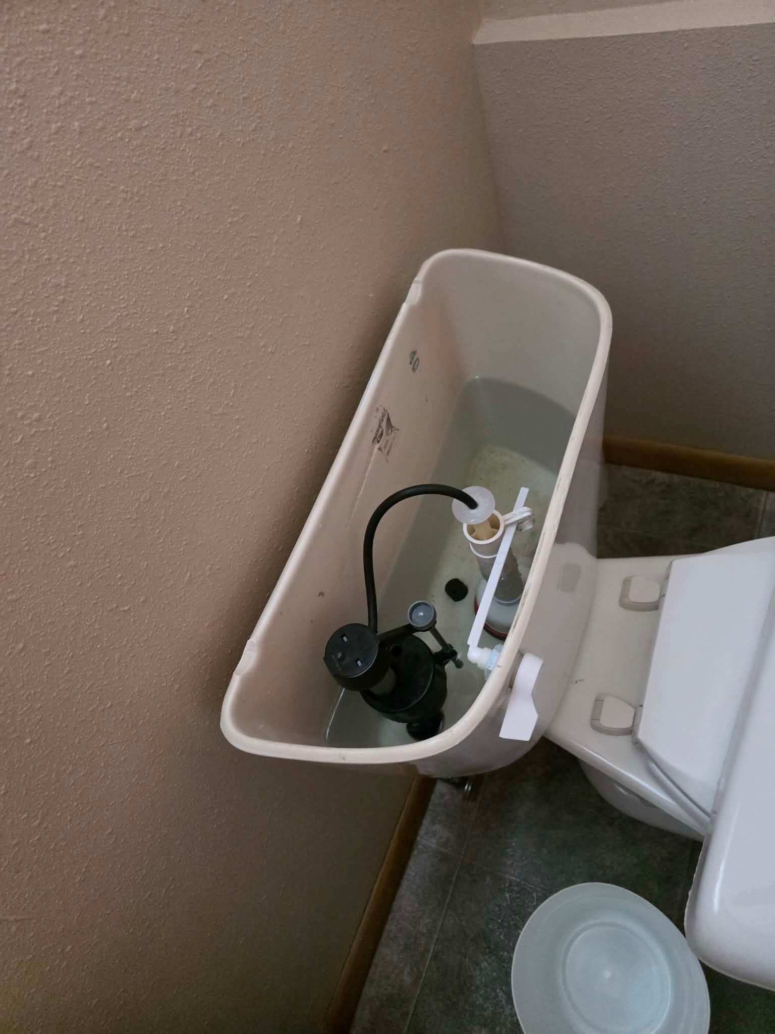 A wooden fence is sitting in the middle of a grassy field.