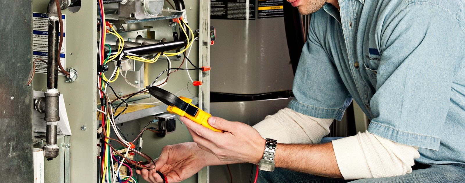 A wooden fence is sitting on top of a lush green field.