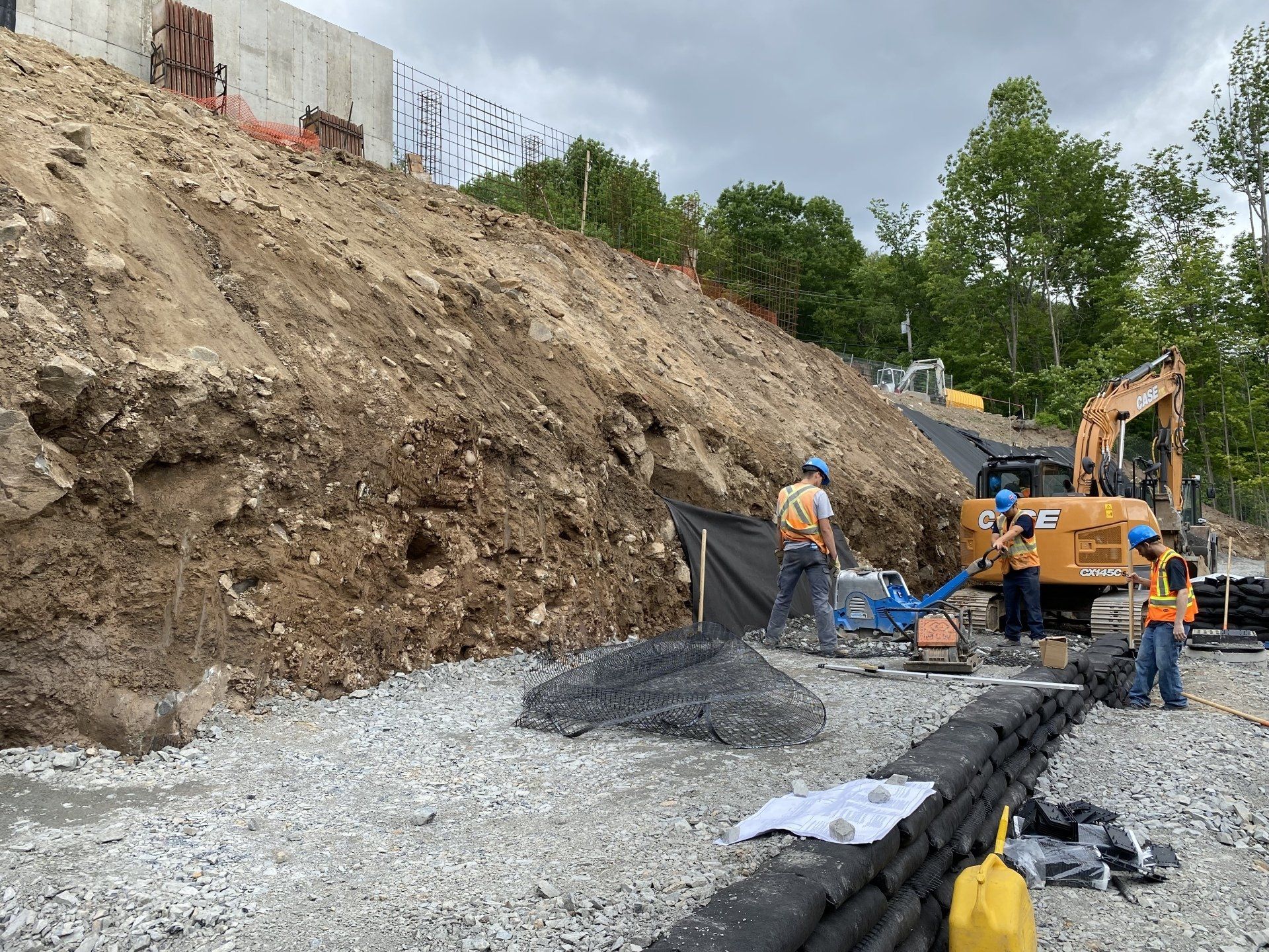 A group of construction workers are working on a construction site.