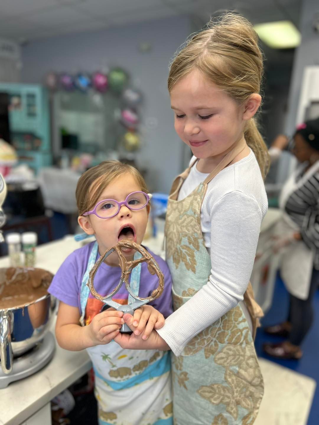 licking the chocolate mixer