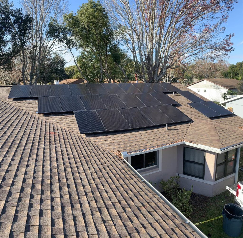 A house with a lot of solar panels on the roof