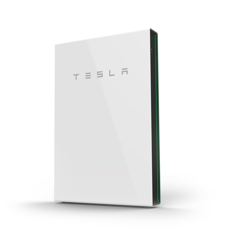 A white tesla battery is sitting on a white surface.