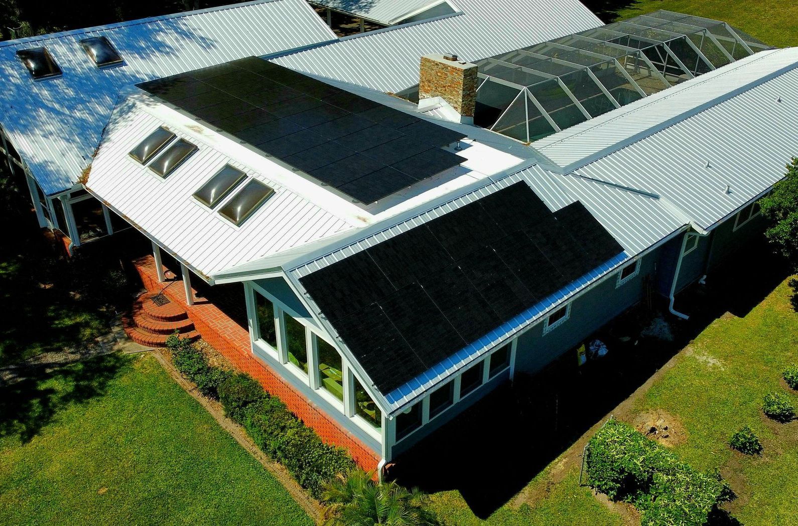 House with solar panels on the roof, showcasing solar power on roof, solar energy cost, and best solar energy solutions.