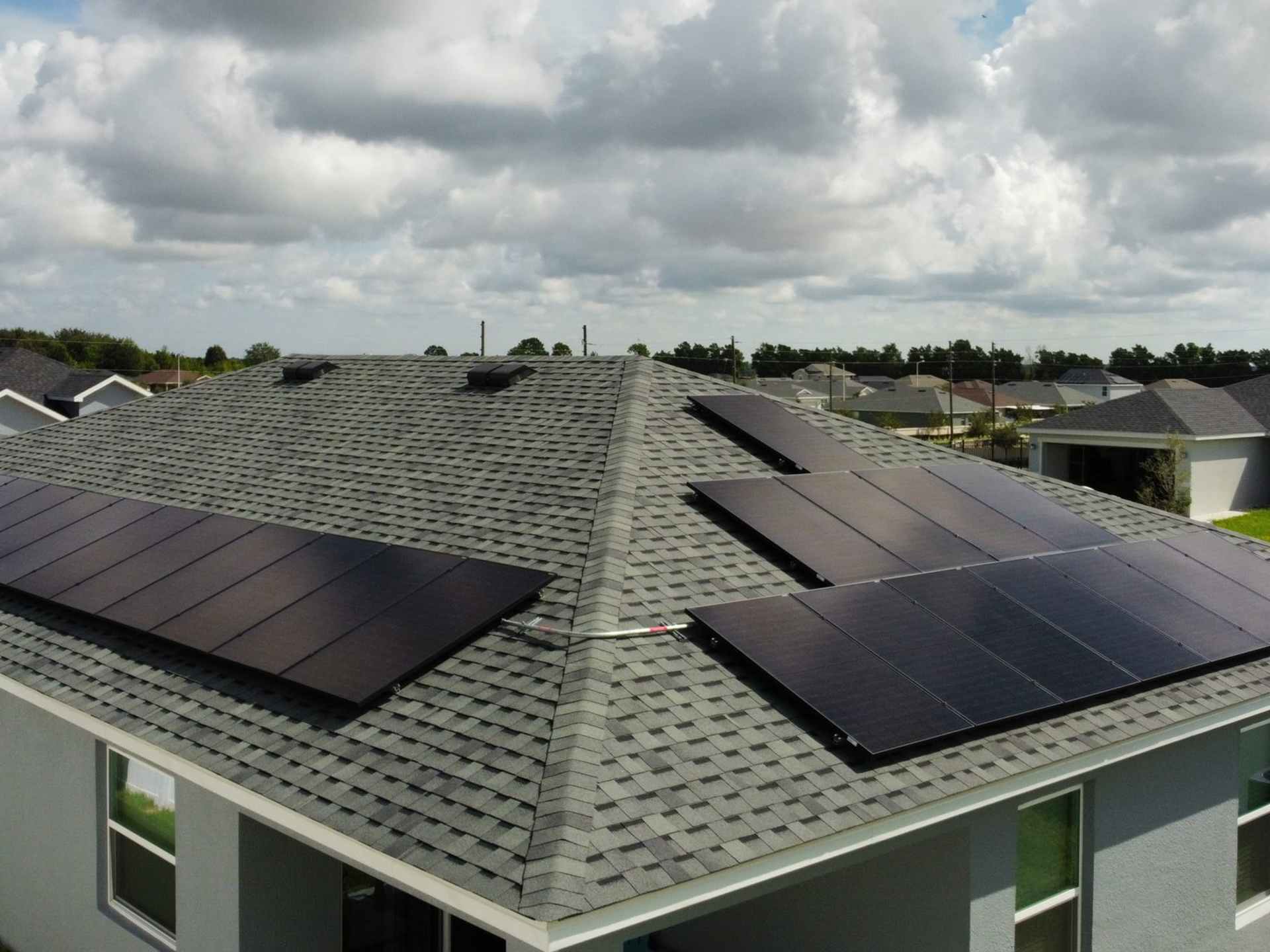 Roof with panels solar panels generating solar power installed by solar installers near me and solar power experts.