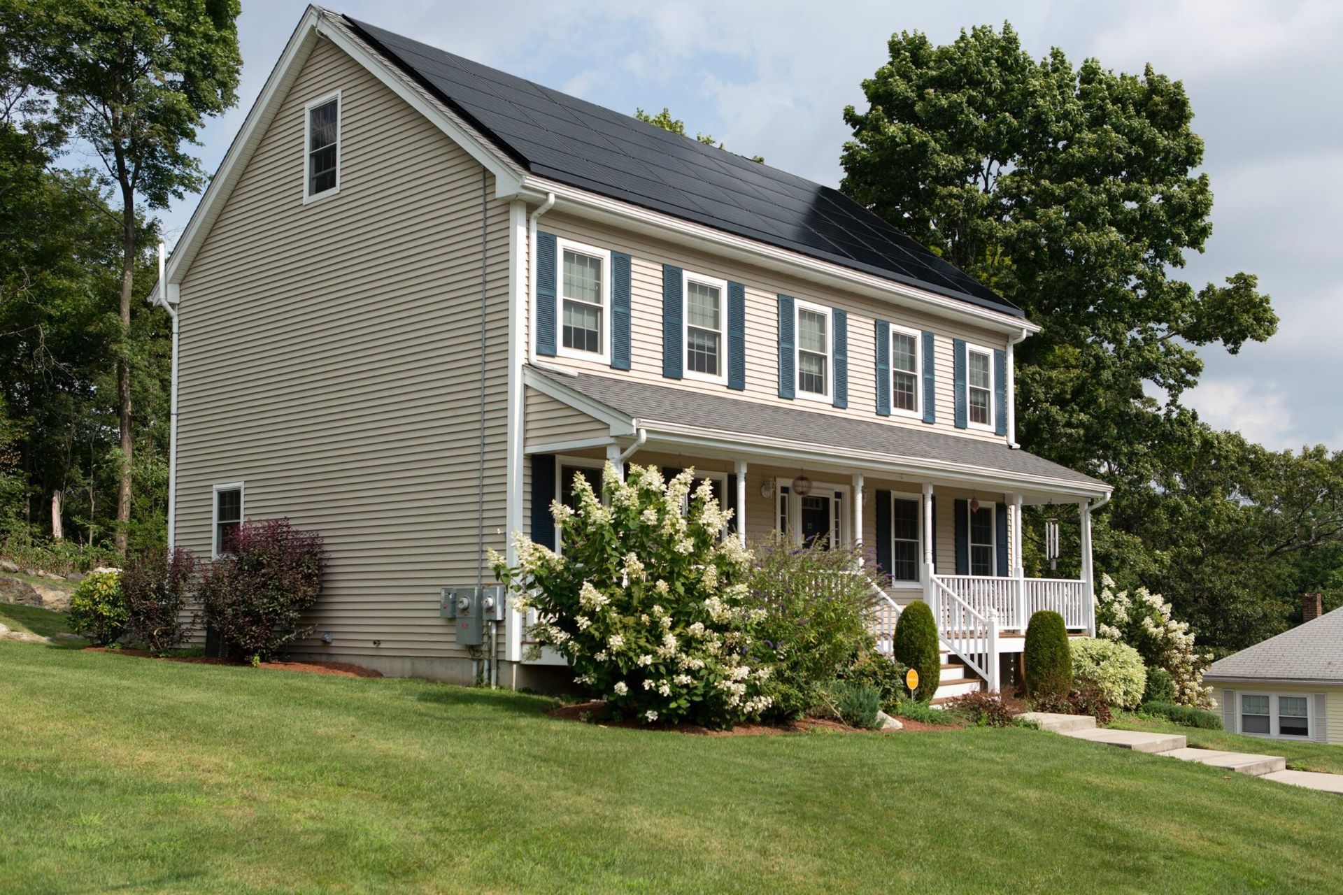 House with solar panels on the roof, showcasing solar power on roof, solar energy cost, and best solar energy solutions.