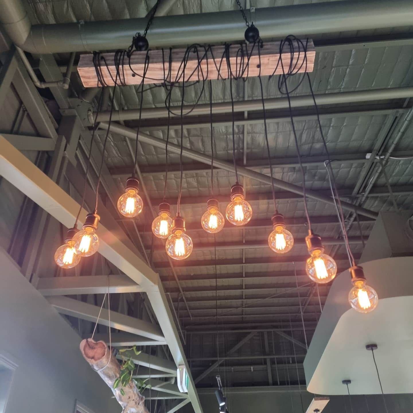 A Bunch of Light Bulbs Are Hanging from The Ceiling — Goldspark GC Electrical in Burleigh Waters, QLD