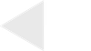 A light gray triangle pointing left on a white background.