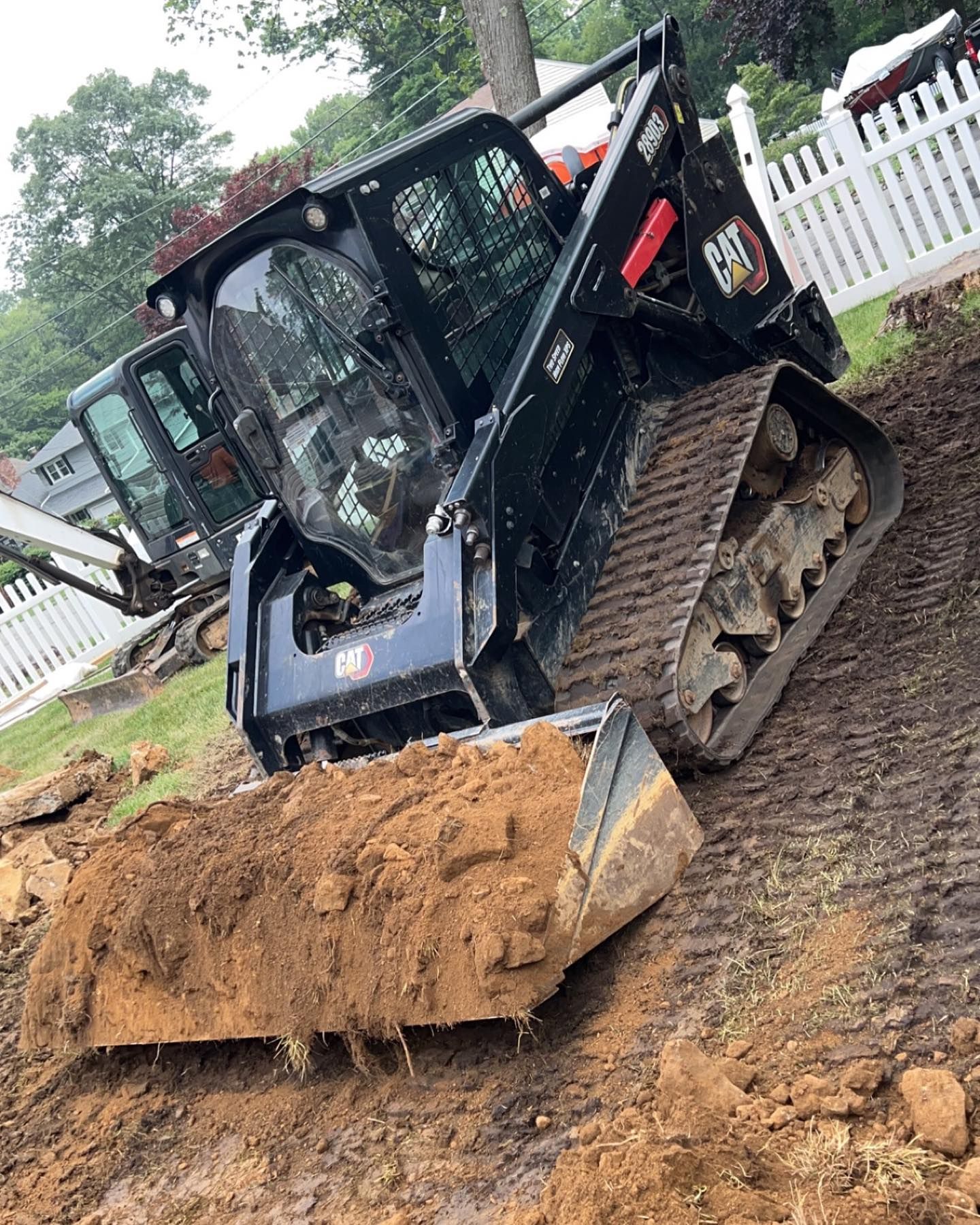 A bulldozer is digging a hole in the ground.